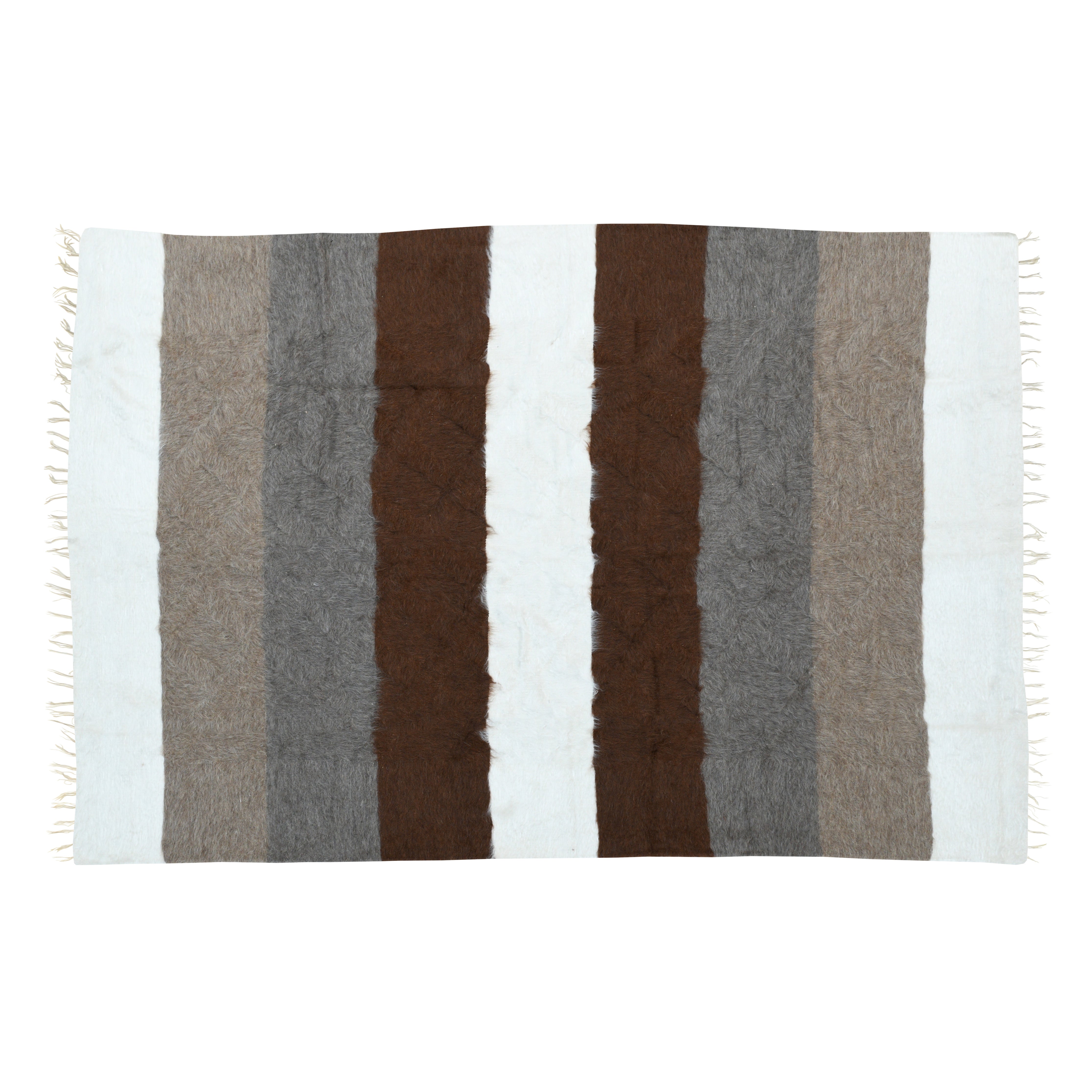 Nordic Stripes rug in organic mohair featuring earthy browns, soft grays, and pure white vertical stripes, inspired by Scandinavian wilderness and handcrafted for luxurious, sustainable home decor.